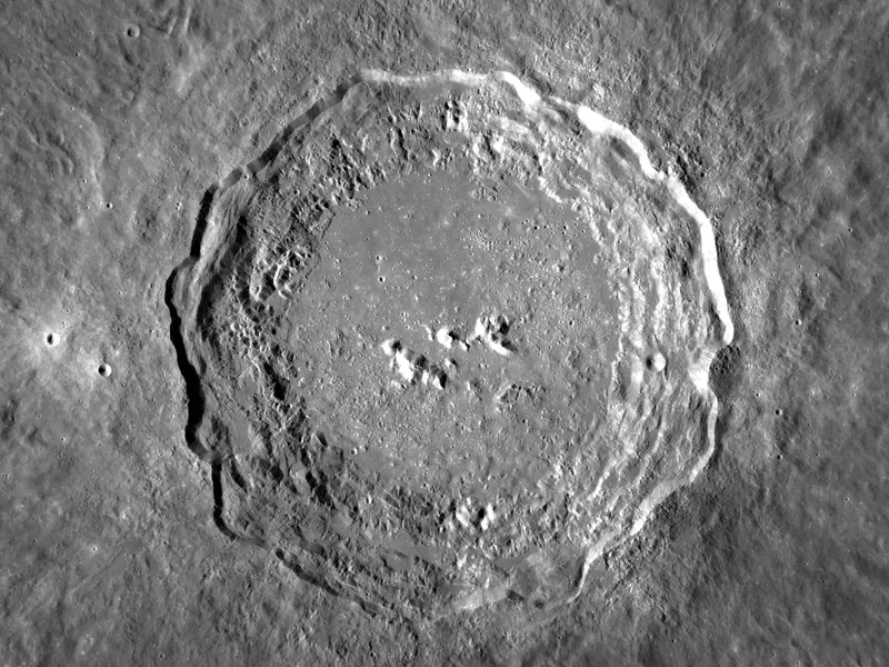 A big crater with terraced walls and a cluster of peaks in the middle
