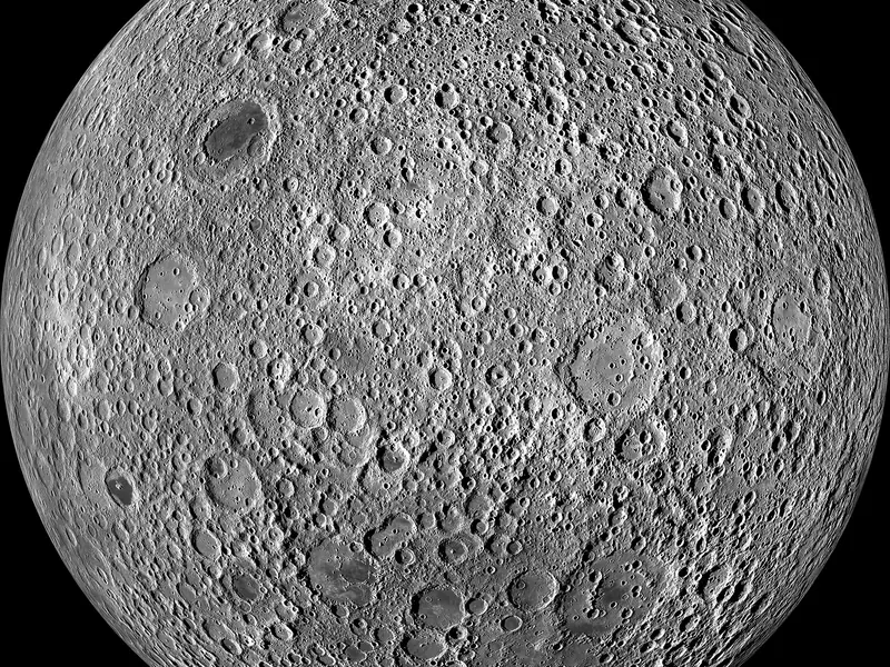 The far side of the Moon: bright and heavily cratered, with very few dark patches